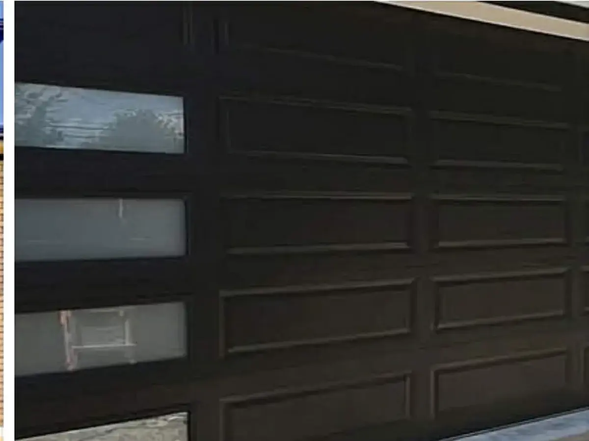 Dark brown garage door with small windows down one side
